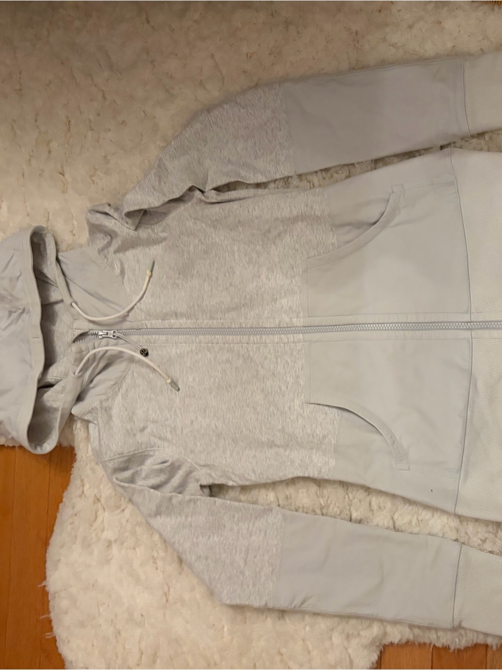 Lululemon Light Gray Women's Zip-Up Hoodie Jacket. I believe it is a small.
